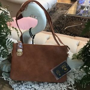 Camel Hadley Purse
Brand new. In its original tags and packaging